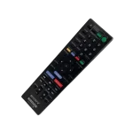 Imagen inclinada del control remoto original Sony RM-ADP11, compatible con sistema BDV-E2100, mostrando claramente botones multimedia y acceso rápido.