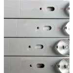 Detalle del Kit de Barras LED compatible con televisores SYLED39T2 V2 y SYLED393T2I, mostrando perforaciones de montaje y lentes LED.